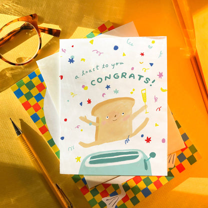 Karen Schipper - Toast Congrats – Food Pun Congratulations Card